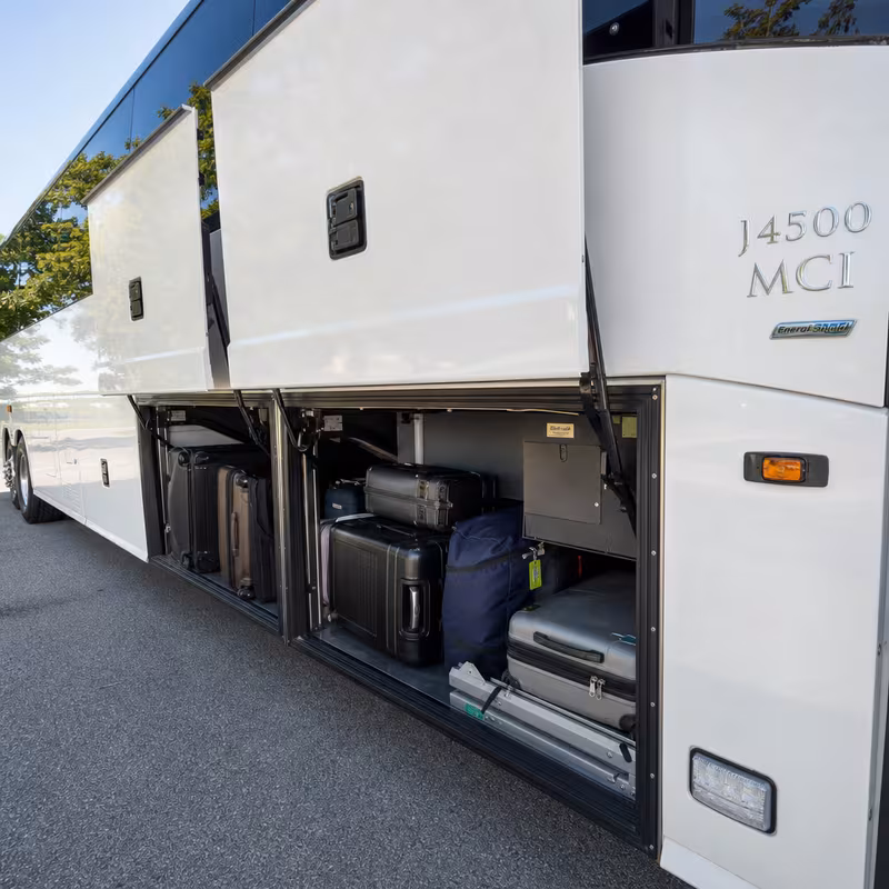 Party bus interior with wraparound leather seating and LED lighting in Seattle