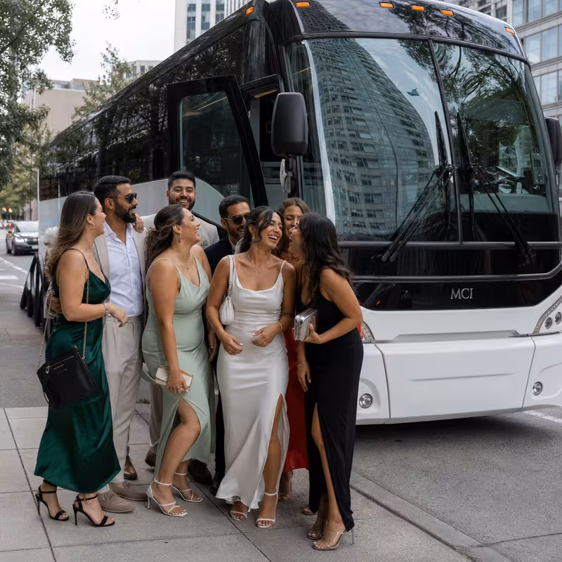 Passengers loading luggage while boarding an Seattle group shuttle