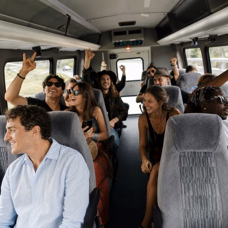 Party bus interior with wraparound leather seating and LED lighting in Seattle