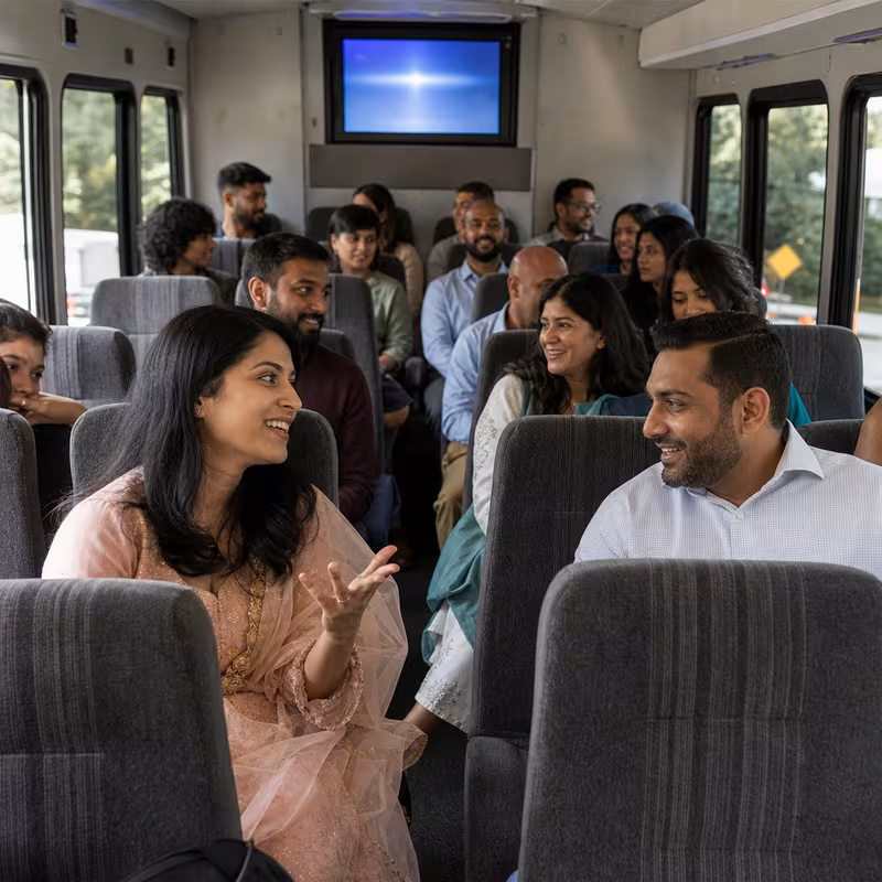 Group boarding a white charter bus for Private Event Transportation transportation in Seattle