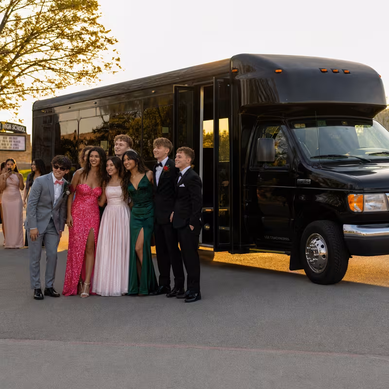 Group boarding a white charter bus for Prom & Homecoming Transportation transportation in Seattle