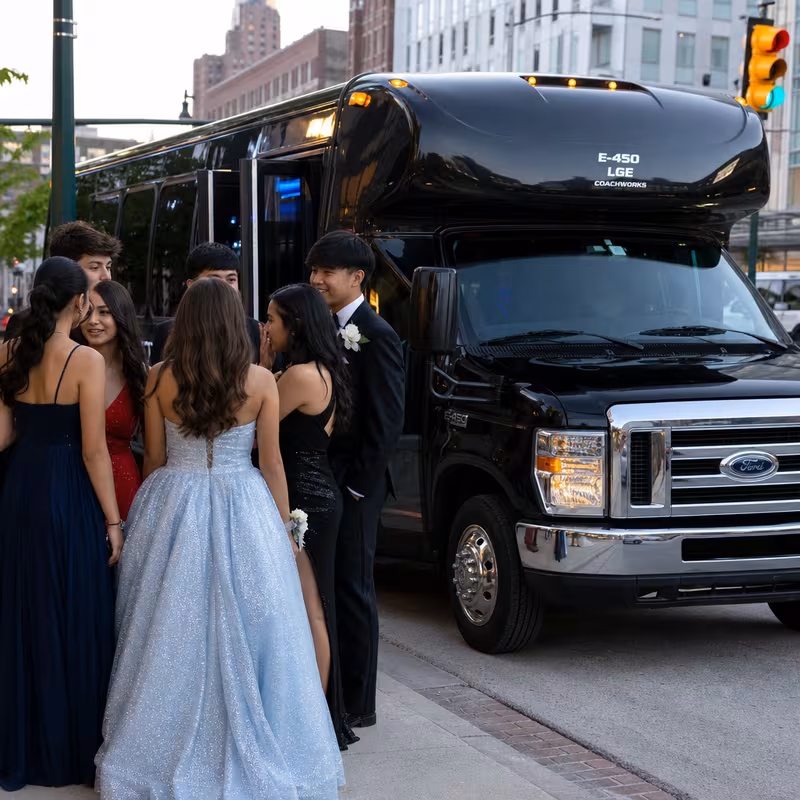 Passengers loading luggage while boarding an Seattle group shuttle